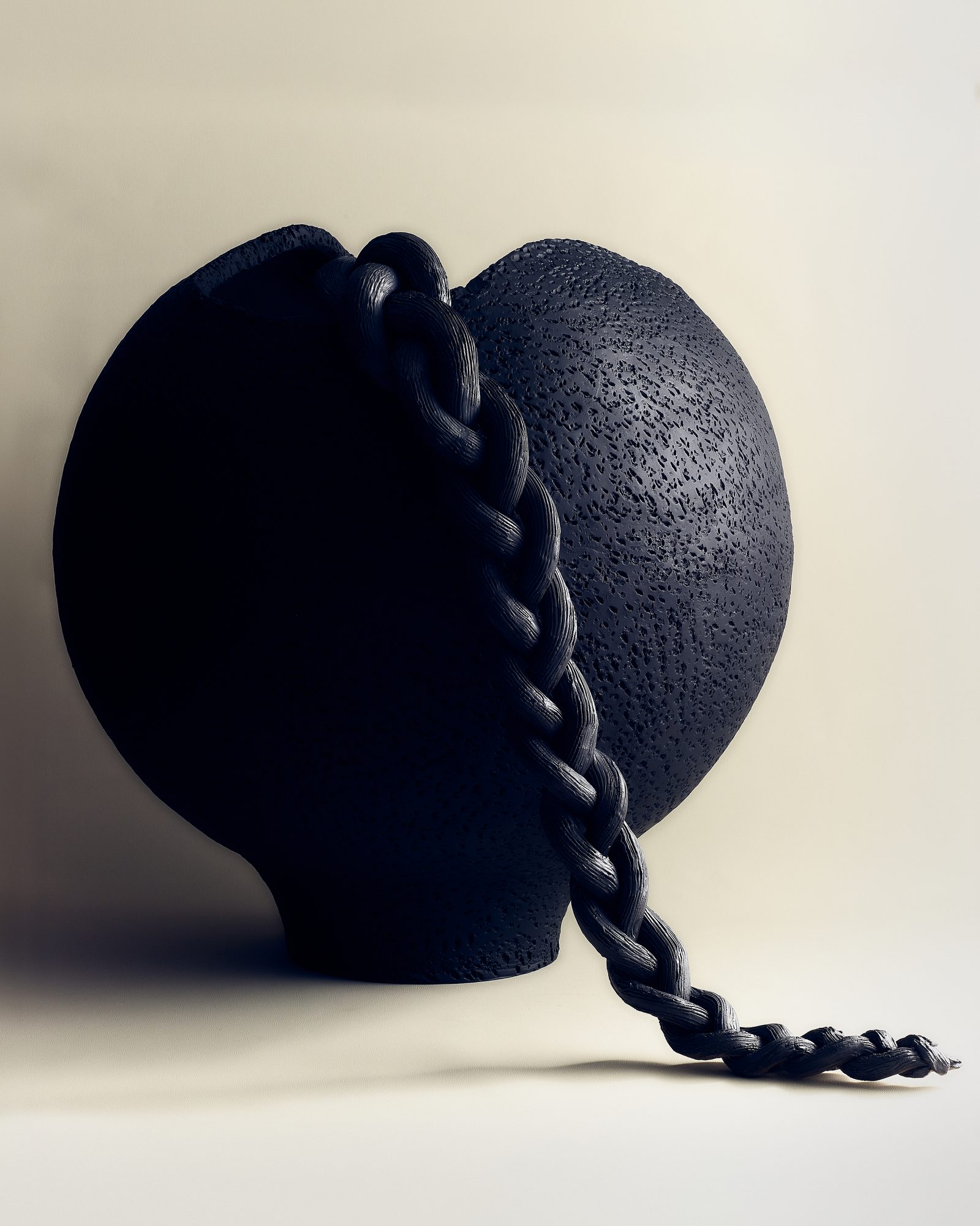 Ceramic vessel with braided iron handle — profile view