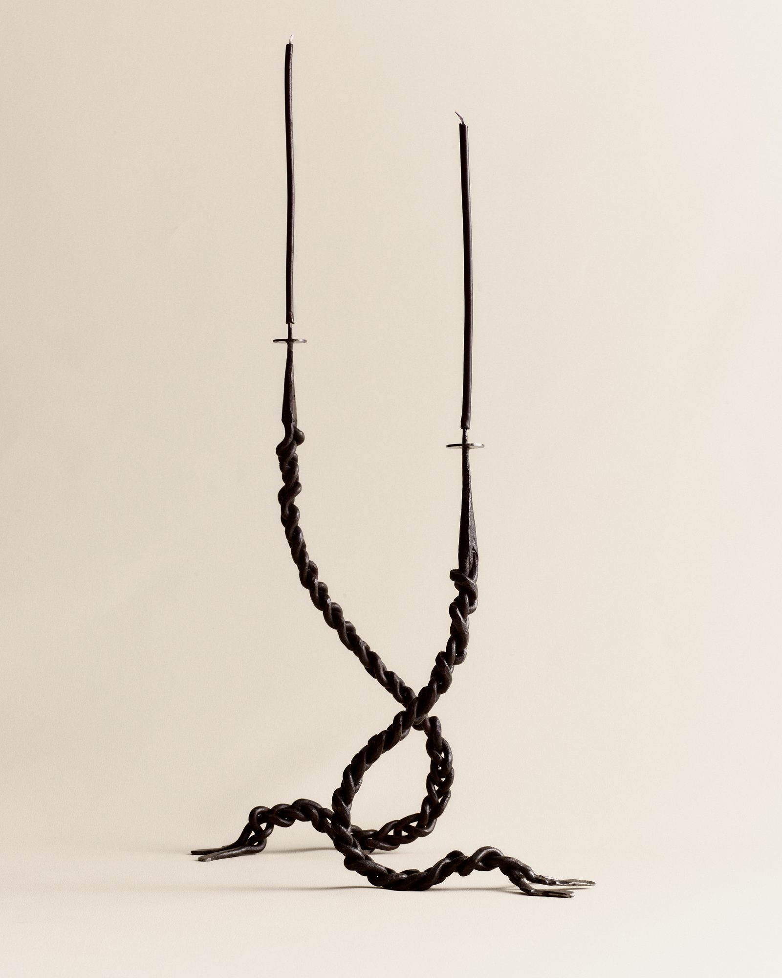 Braided iron candelabra — sculptural centerpiece