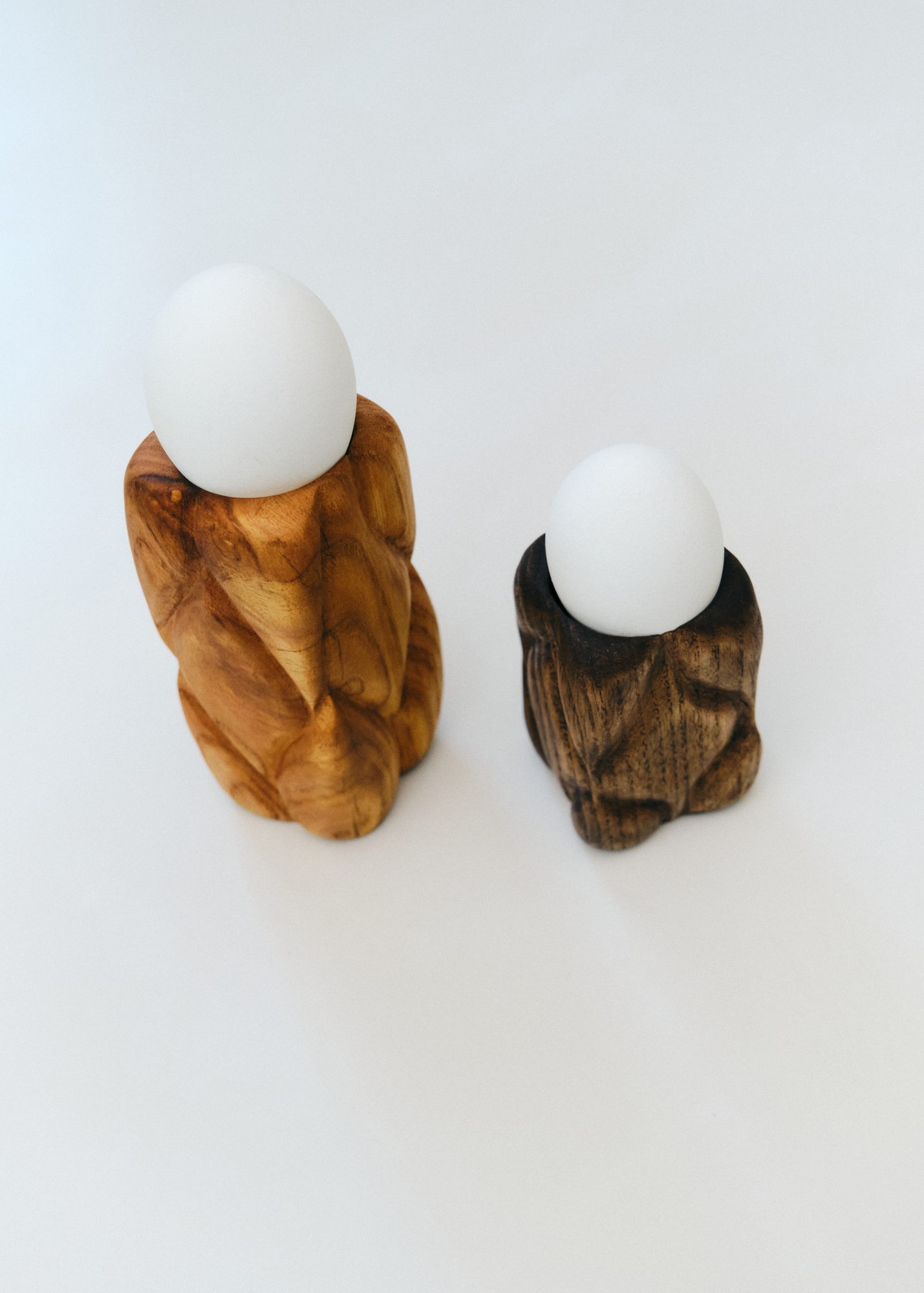 Carved wood egg cups in olive and walnut